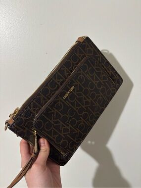 Calvin Klein  Dark Brown Signature Logo Wristlet with Gold Hardware